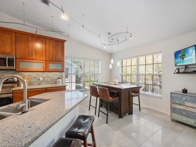 $625,000 | 5620 Whisperwood Boulevard, Unit 1203, Naples, FL 34110