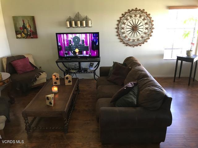 3504 Olds Road Oxnard, CA 93033 - Photo 3 of 9 a living room with furniture a rug and a flat screen tv