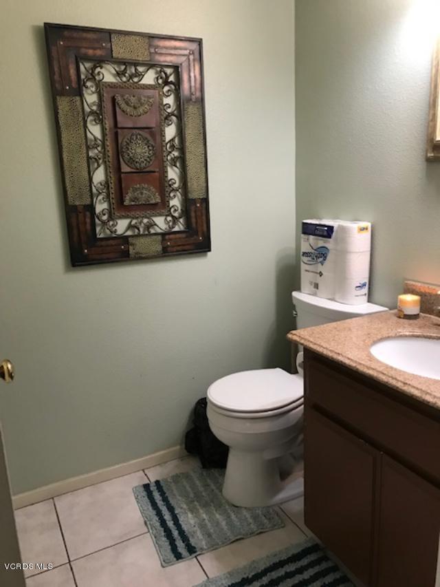 3504 Olds Road Oxnard, CA 93033 - Photo 8 of 9 a bathroom with a toilet sink and mirror