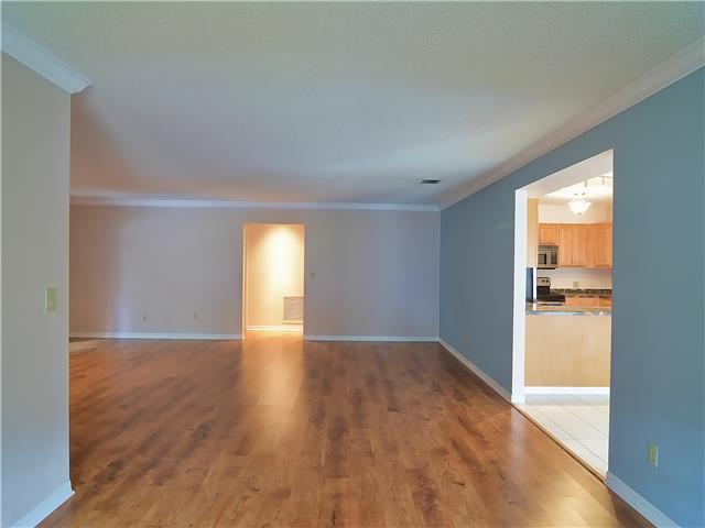13 Palm Road Sewall's Point, FL 34996 - Photo 11 of 25 a view of empty room with wooden floor and fan