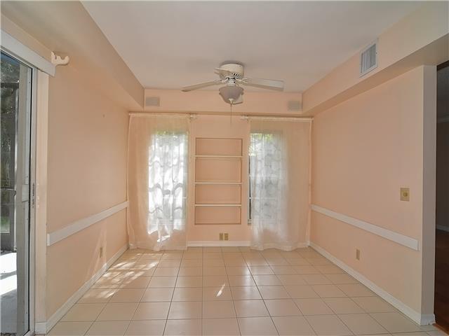13 Palm Road Sewall's Point, FL 34996 - Photo 14 of 25 a view of an empty room with window and chandelier fan