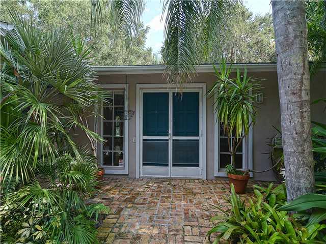 13 Palm Road Sewall's Point, FL 34996 - Photo 6 of 25 a couple of potted plants in front of door