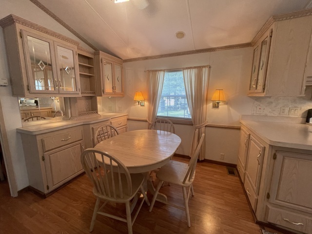 4-52 Woodhaven Lakes Sublette, IL 61367 - Photo 11 of 35 a kitchen that has a table chairs in it and wooden floors