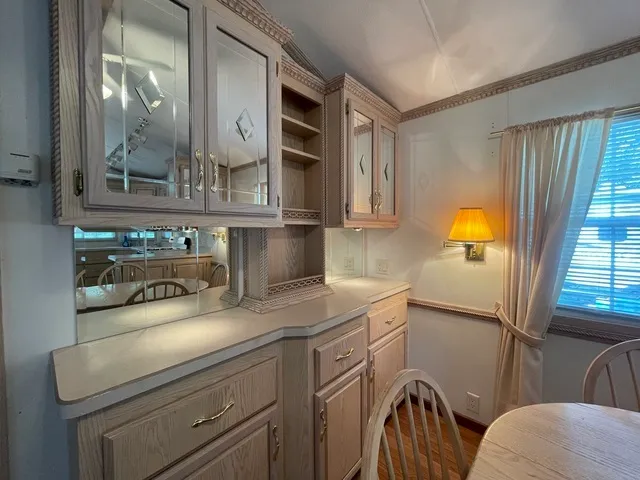a kitchen with a sink a stove and cabinets