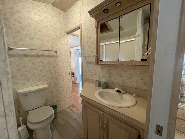 4-52 Woodhaven Lakes Sublette, IL 61367 - Photo 16 of 35 a bathroom with a sink toilet and shower