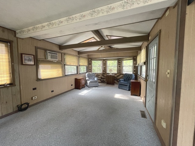 4-52 Woodhaven Lakes Sublette, IL 61367 - Photo 23 of 35 a view of a livingroom with furniture cabinet and windows