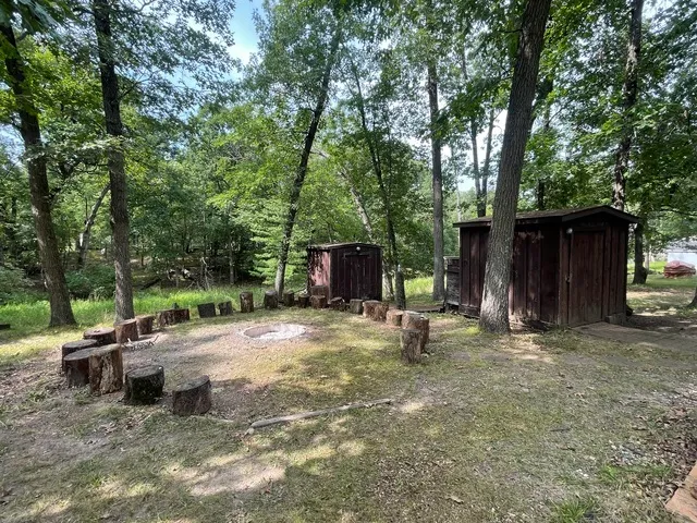 a backyard of a house with yard and trampoline