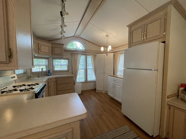 4-52 Woodhaven Lakes Sublette, IL 61367 - Photo 6 of 35 a kitchen with refrigerator and window
