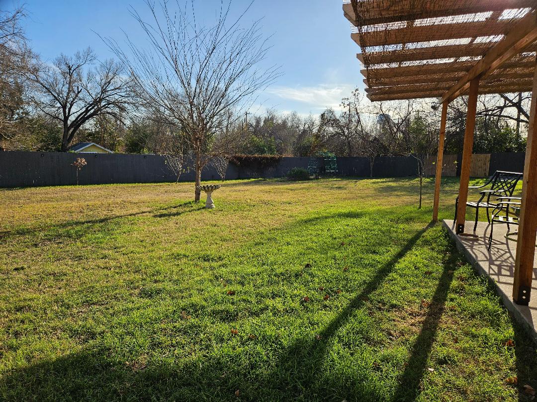 710 North Avenue C Elgin, TX 78621 - Photo 30 of 33 a view of an outdoor space and yard