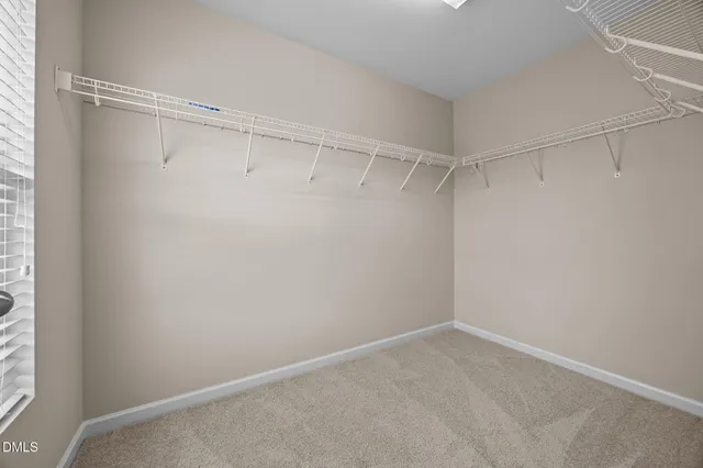 a view of a room with shelf on the wall