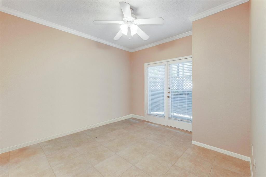 3111 Tom Green Street, Unit 108 Austin, TX 78705 - Photo 6 of 12 an empty room with windows and fan