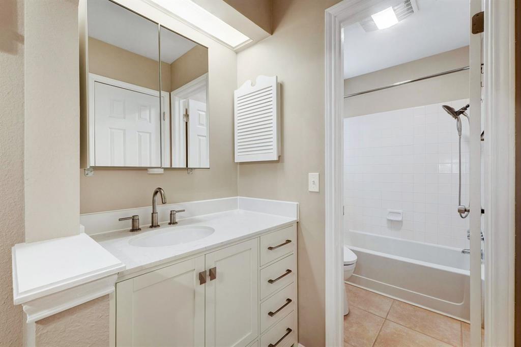 3111 Tom Green Street, Unit 108 Austin, TX 78705 - Photo 7 of 12 a bathroom with a sink toilet vanity and shower
