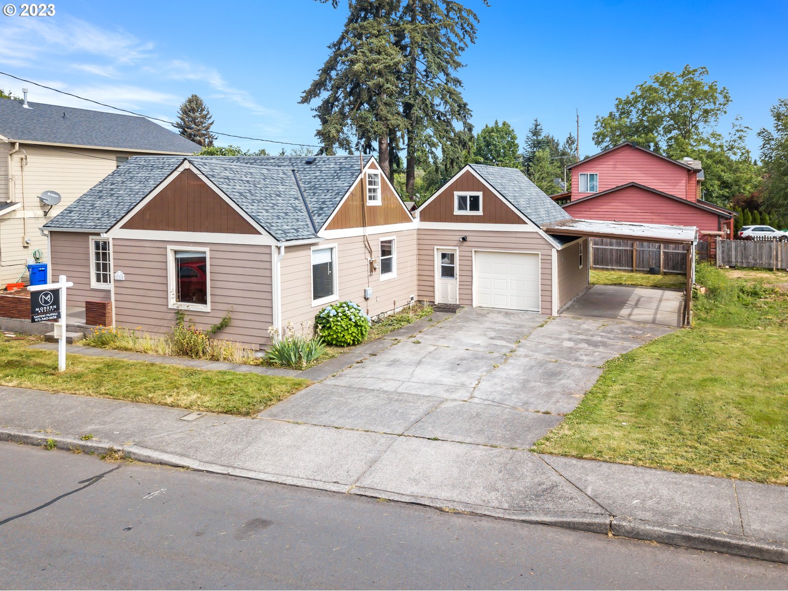711 Southeast 5th Street Gresham, OR 97080 - Photo 1 of 25 a front view of a house with a yard and garage