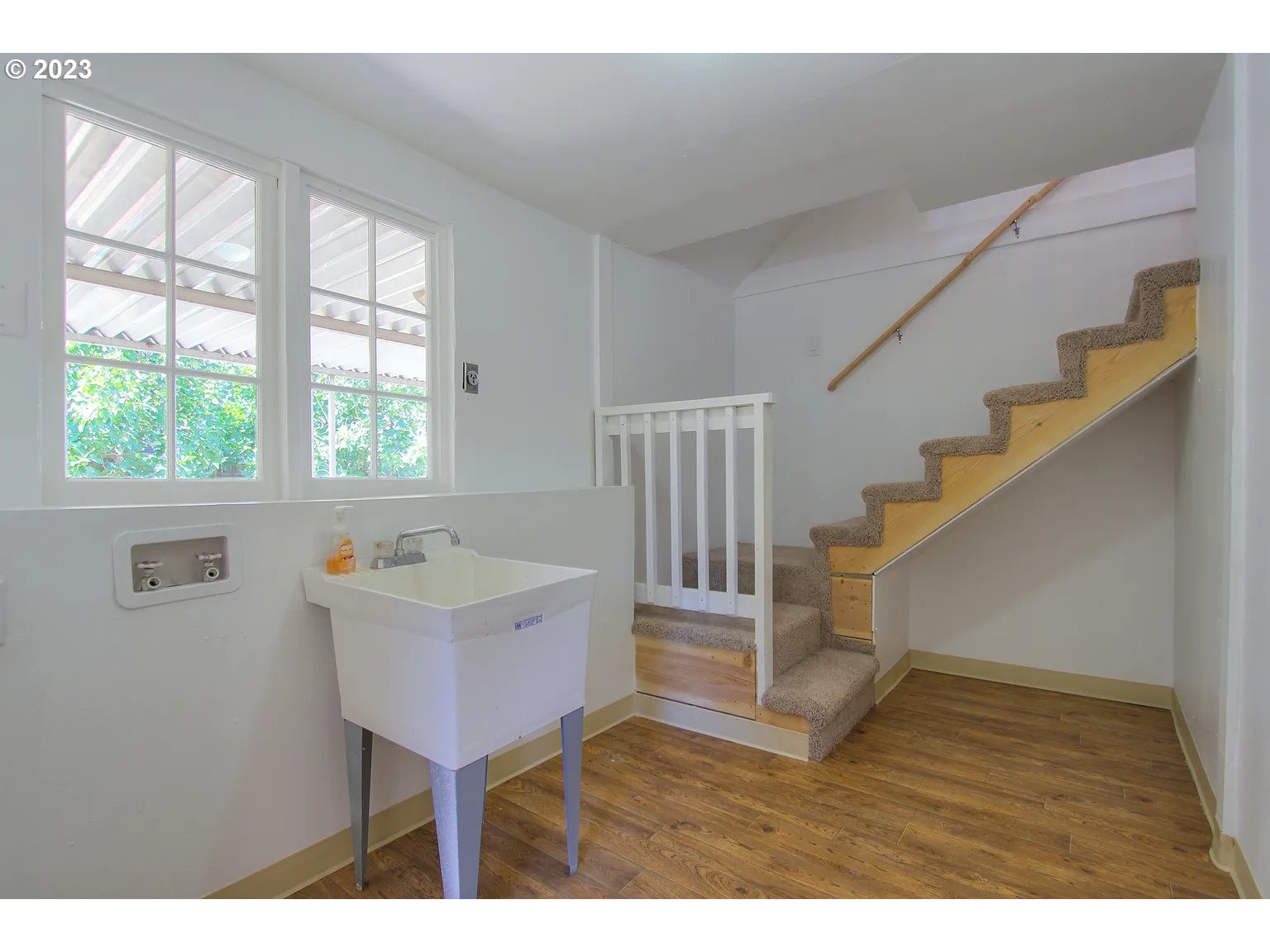 711 Southeast 5th Street Gresham, OR 97080 - Photo 17 of 25 a view of a livingroom with wooden floor and furniture