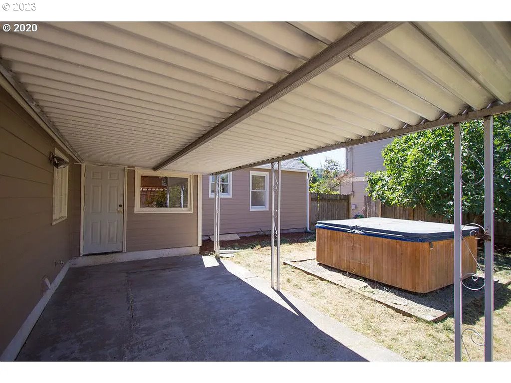 711 Southeast 5th Street Gresham, OR 97080 - Photo 19 of 25 a backyard of a house with basket ball court and floor to ceiling window