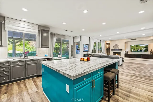 a dining room with a glass table and windows
