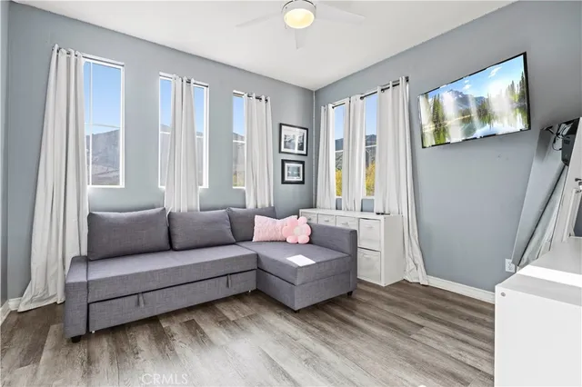 a view of a patio with table and chairs and potted plants