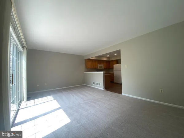 an empty room with an entrance and door