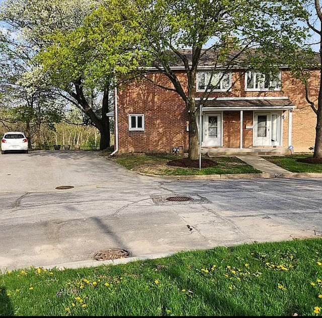 37 Choate Road Park Forest, IL 60466 - Photo 1 of 17 a front view of a house with a garden