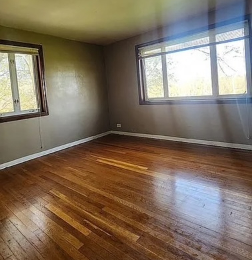 37 Choate Road Park Forest, IL 60466 - Photo 12 of 17 a view of an empty room with wooden floor and a window