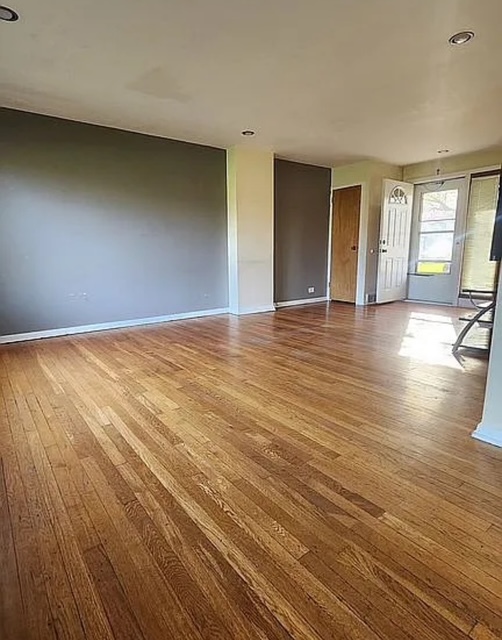 37 Choate Road Park Forest, IL 60466 - Photo 4 of 17 a view of empty room with wooden floor and fireplace