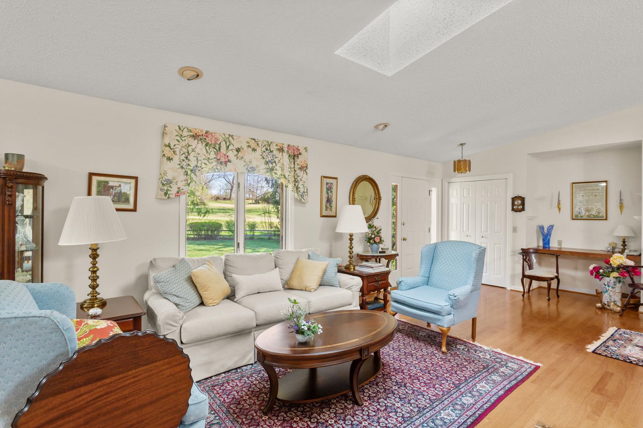 13004 Indian Trail Road Broadway, VA 22815 - Photo 4 of 56 a living room with furniture a rug and a large window