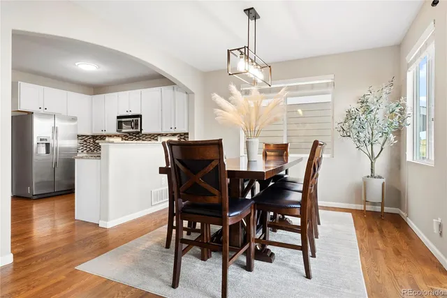 a view of a dining room with furniture window and wooden floor