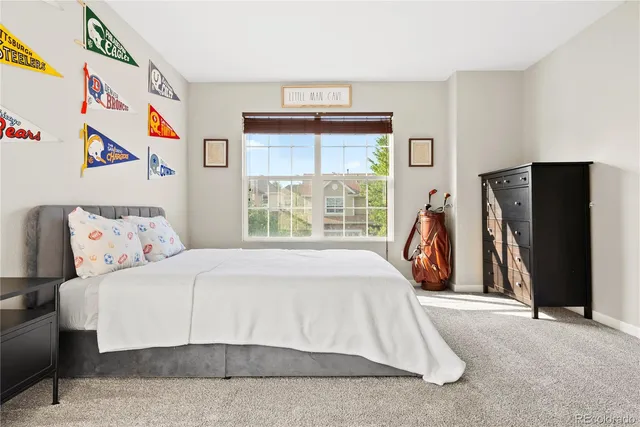 a bed room with a bed and a large window