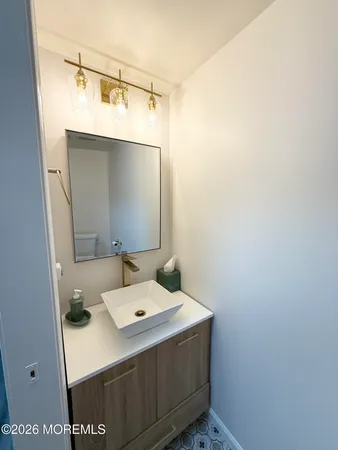 an empty room with a empty space and windows