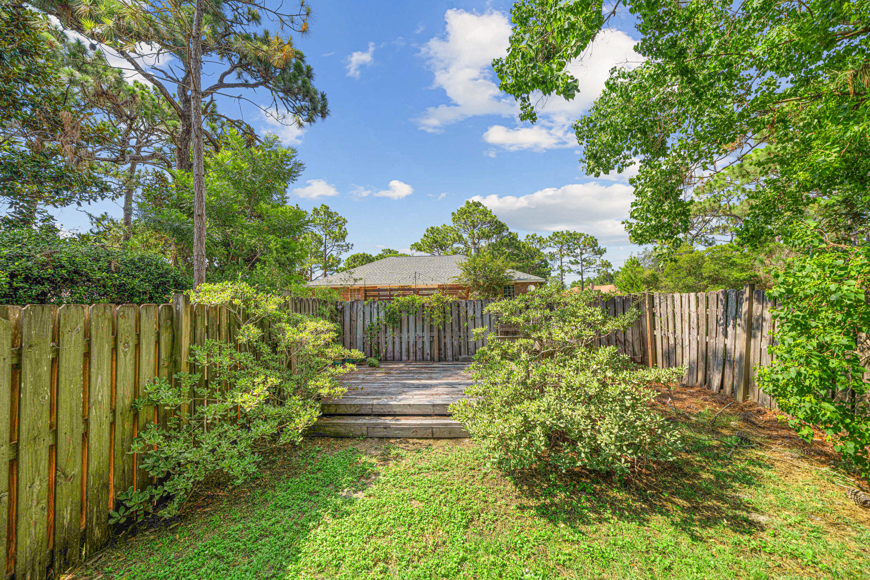 42 Vía Largo, Unit 7B Santa Rosa Beach, FL 32459 - Photo 17 of 36 a view of a garden with pathway