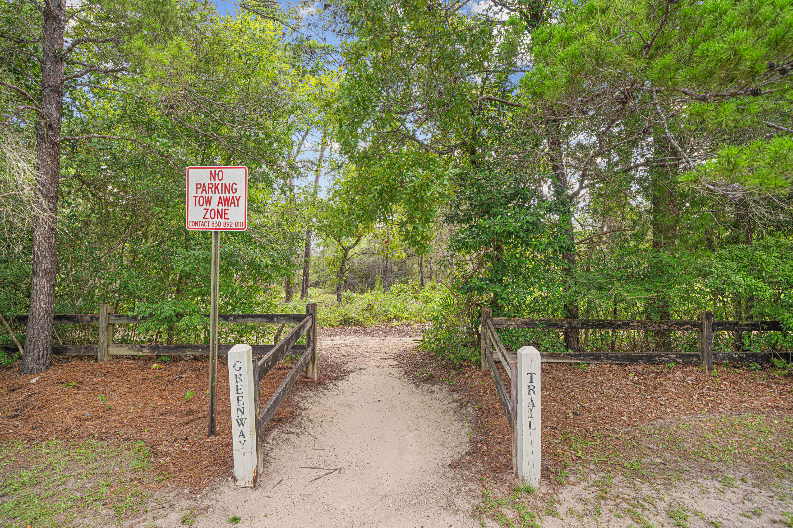 42 Vía Largo, Unit 7B Santa Rosa Beach, FL 32459 - Photo 21 of 36 a green field with trees in the background
