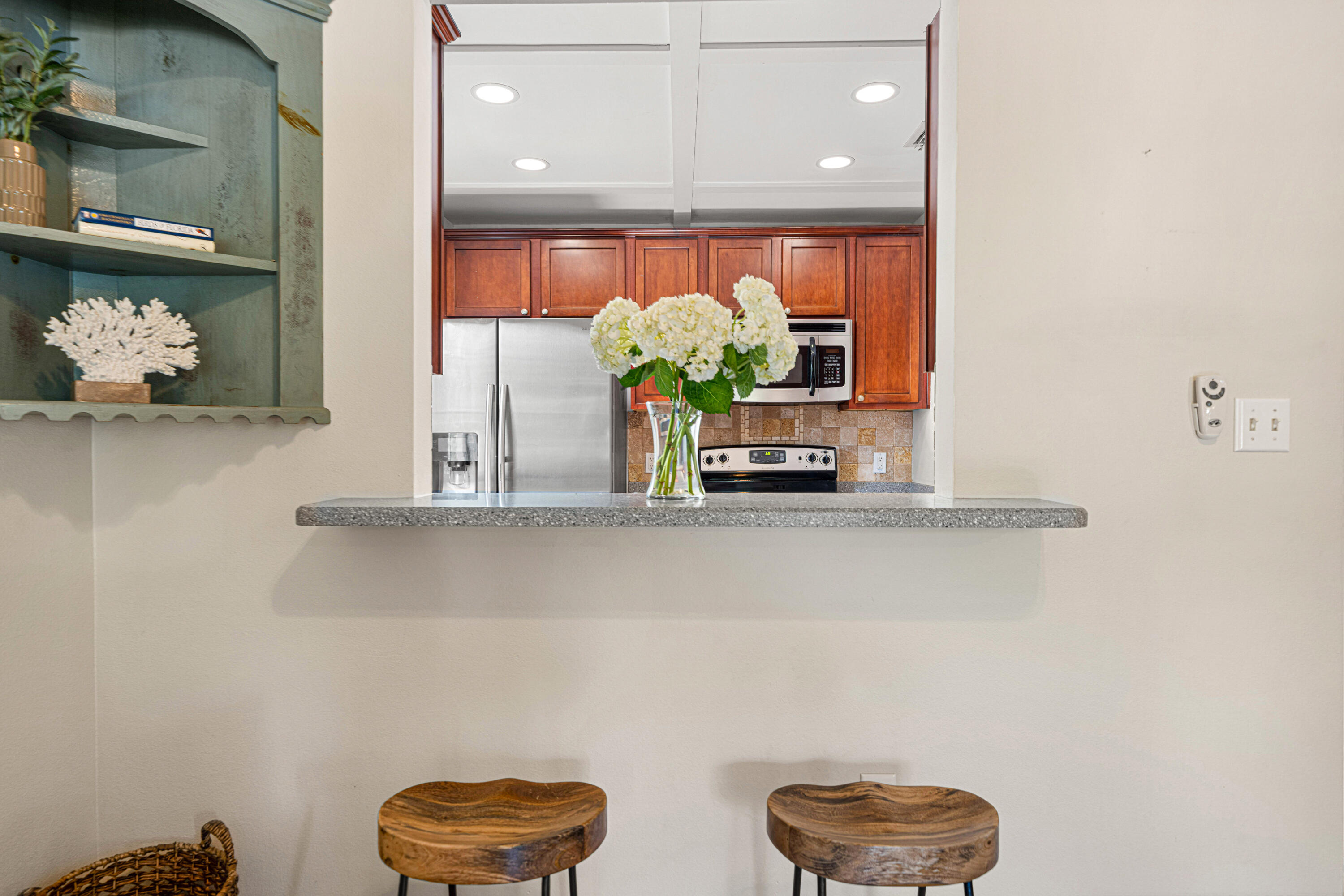 42 Vía Largo, Unit 7B Santa Rosa Beach, FL 32459 - Photo 4 of 36 a potted plant sitting on top of a shelf