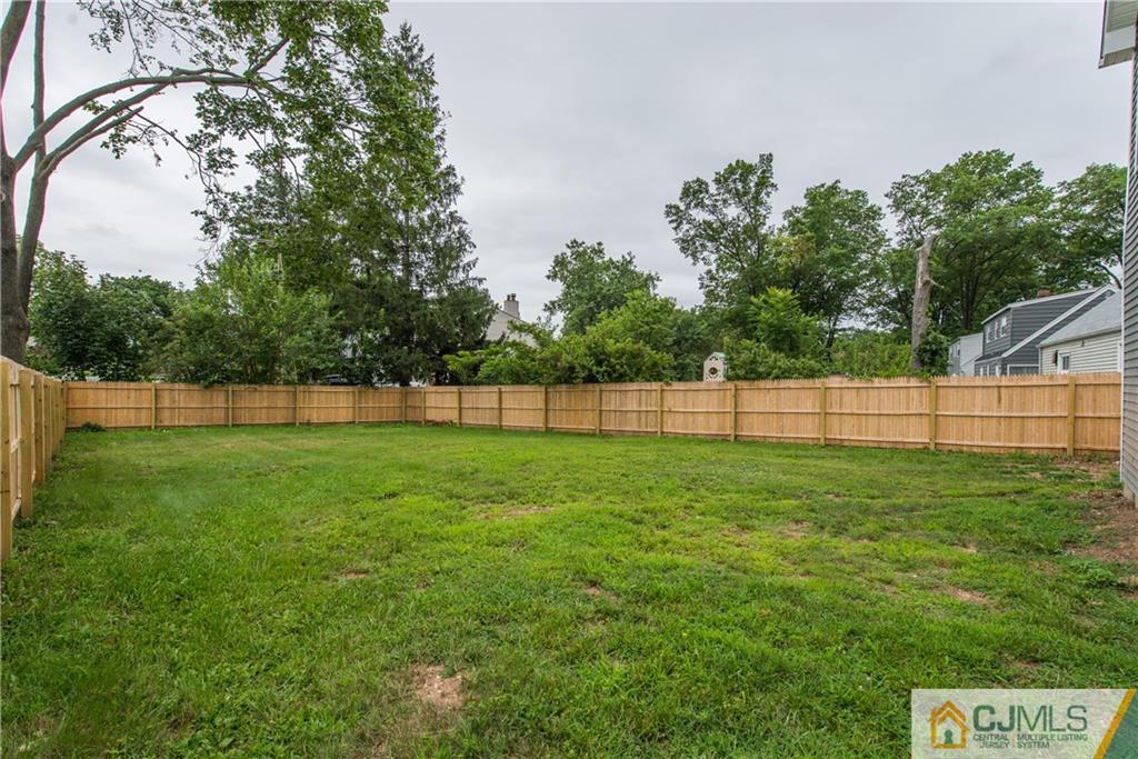 60 Morgan Drive Edison, NJ 08817 - Photo 18 of 20 a view of a backyard with a garden and entertaining space