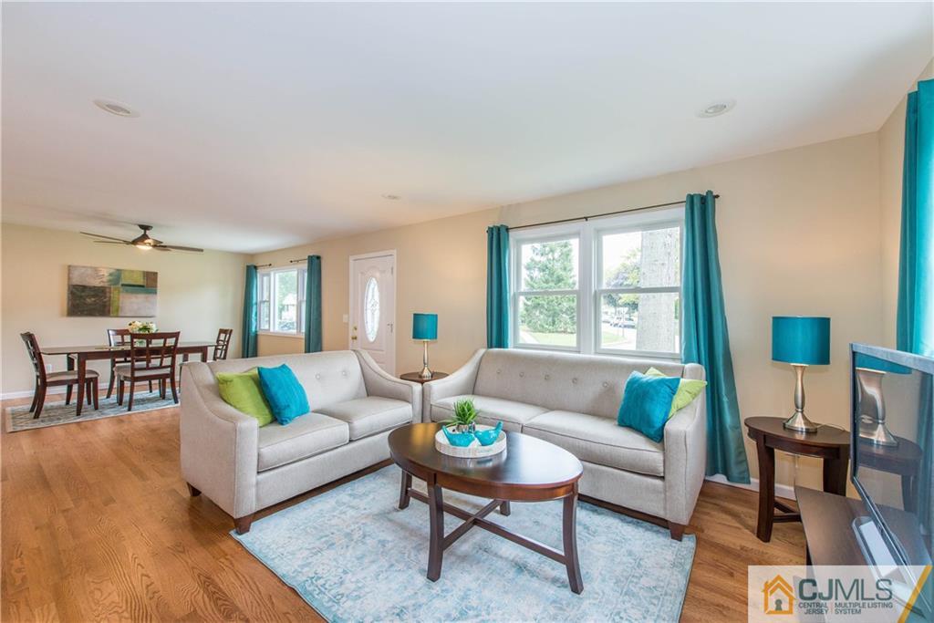 60 Morgan Drive Edison, NJ 08817 - Photo 4 of 20 a living room with furniture and a large window