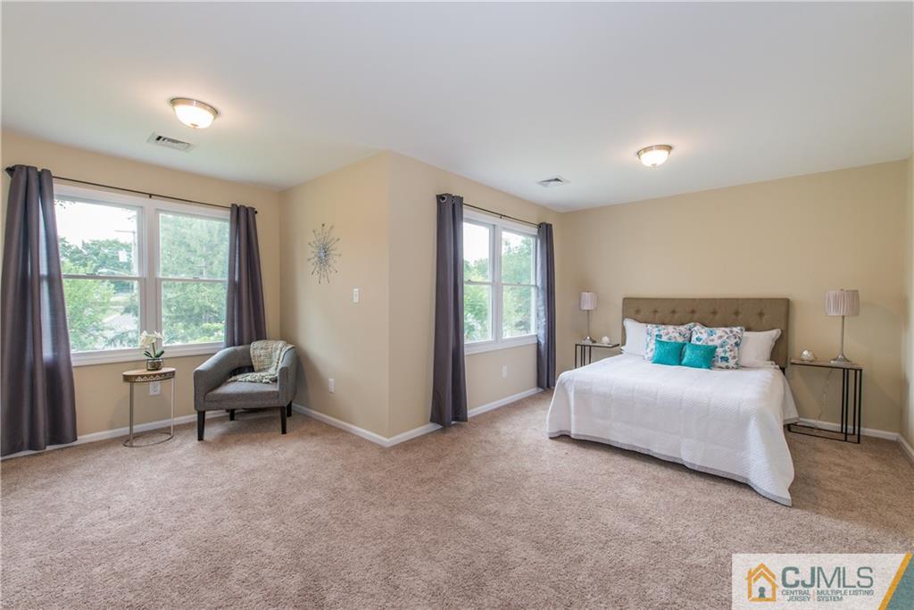 60 Morgan Drive Edison, NJ 08817 - Photo 10 of 20 a living room with furniture and a large window