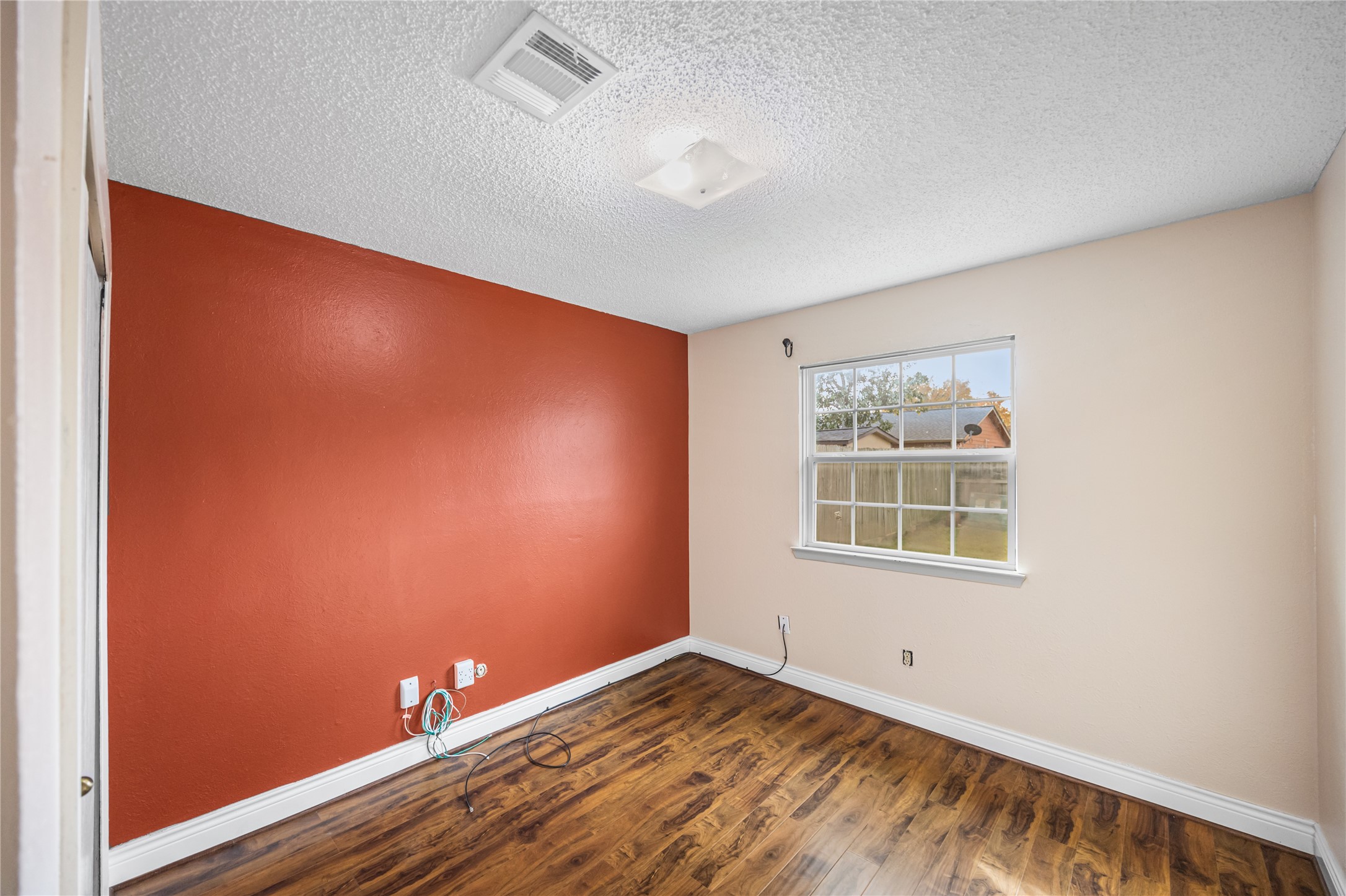 7211 Sandswept Lane Houston, TX 77086 - Photo 11 of 29 an empty room with a window