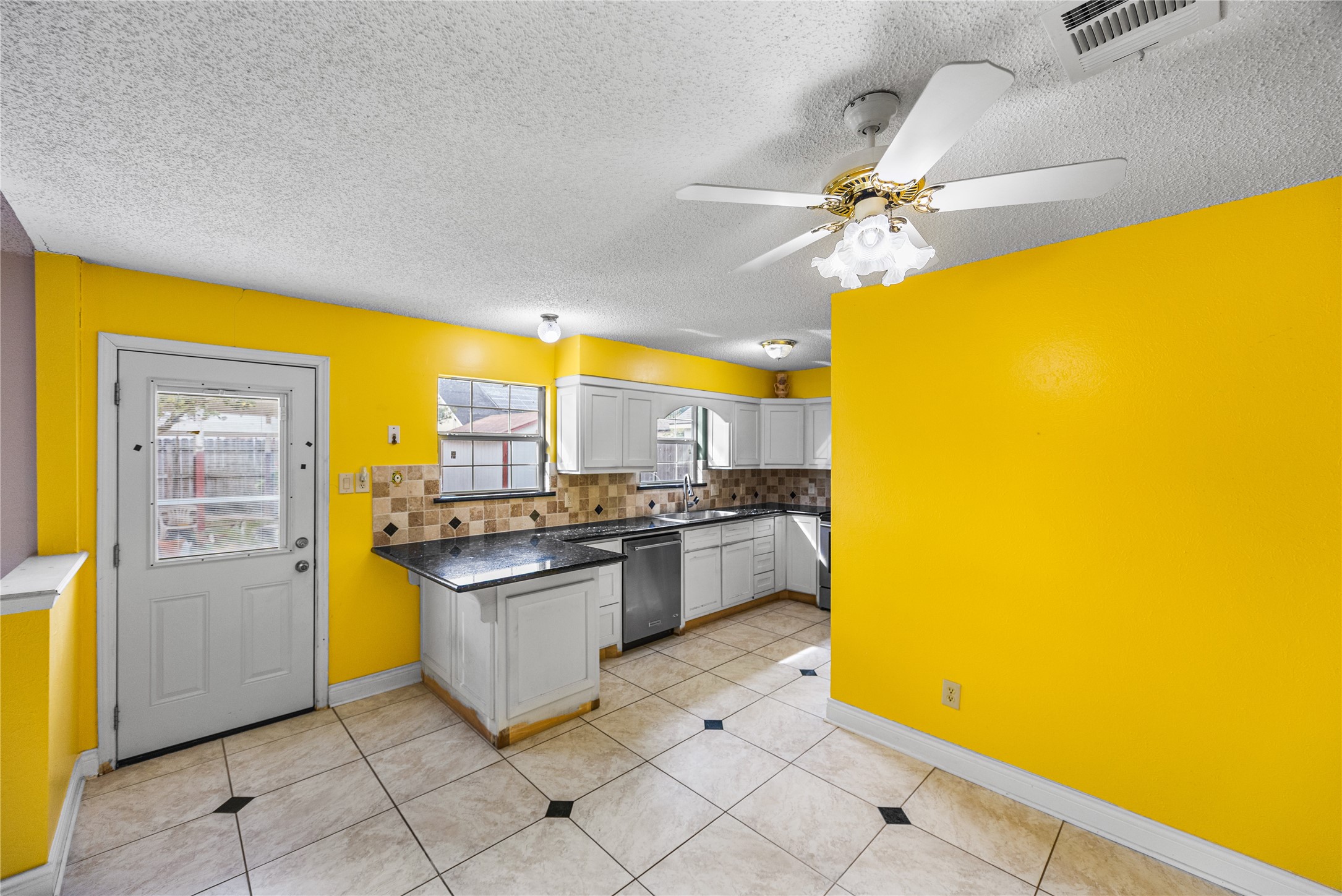 7211 Sandswept Lane Houston, TX 77086 - Photo 18 of 29 a kitchen with a sink appliances and cabinets