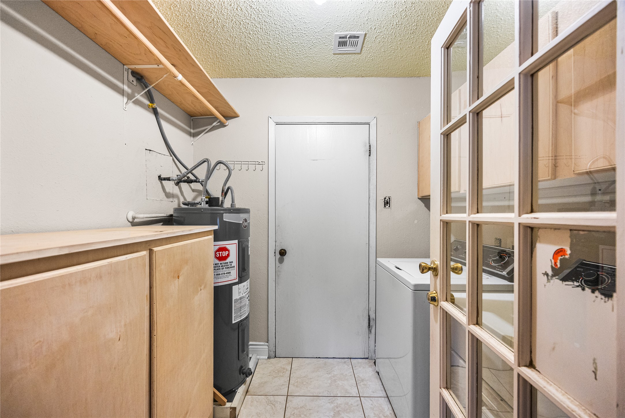7211 Sandswept Lane Houston, TX 77086 - Photo 24 of 29 a utility room with dryer and washer