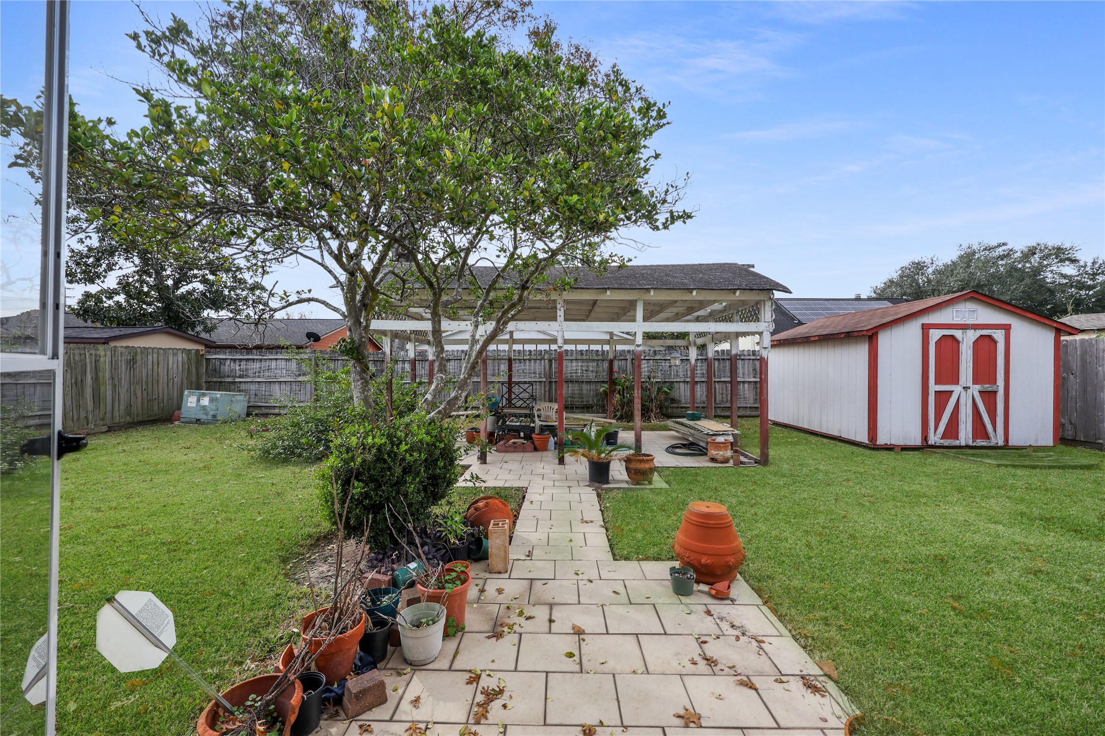 7211 Sandswept Lane Houston, TX 77086 - Photo 25 of 29 a view of a backyard with sitting area