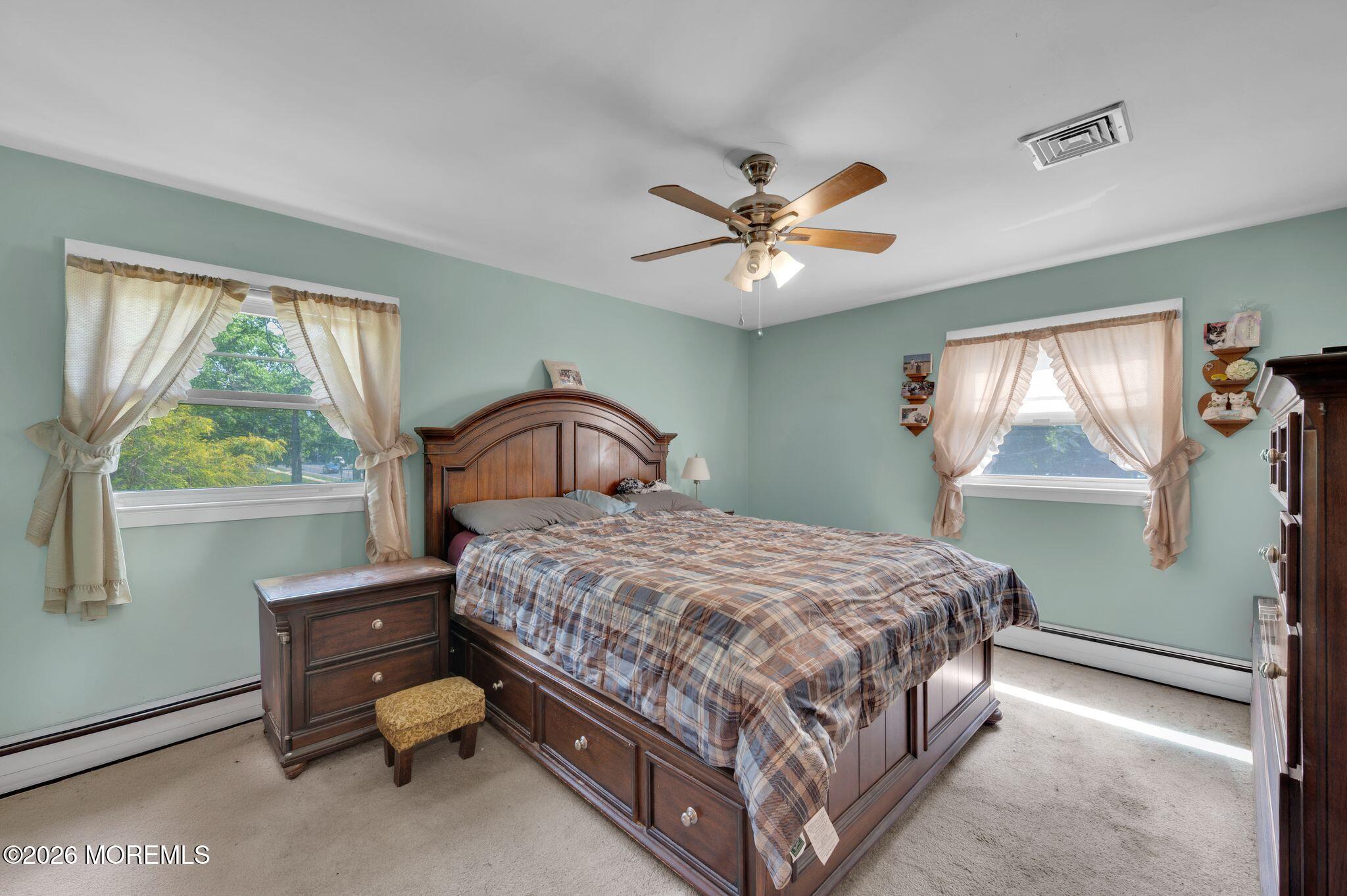 2604 Logan Road Asbury Park, NJ 07712 - Photo 19 of 39 a bedroom with a bed and a window