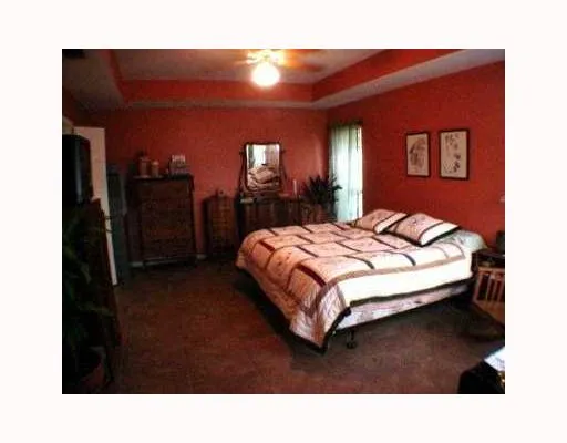 a bedroom with a bed and a view of bathroom