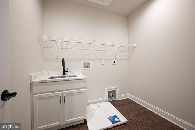 a view of a storage & utility room with wooden floor