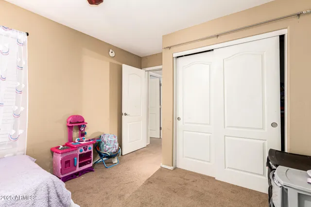 a bedroom with furniture and a window