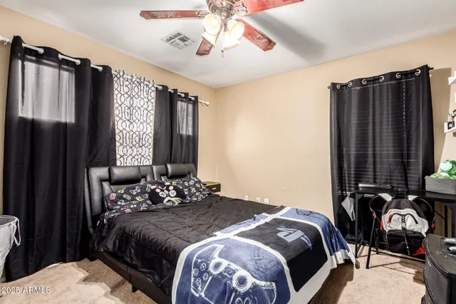 a bedroom with a bed next to a window with the outer view