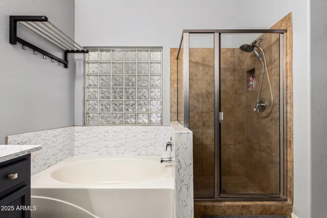 a bathroom with a shower and a sink