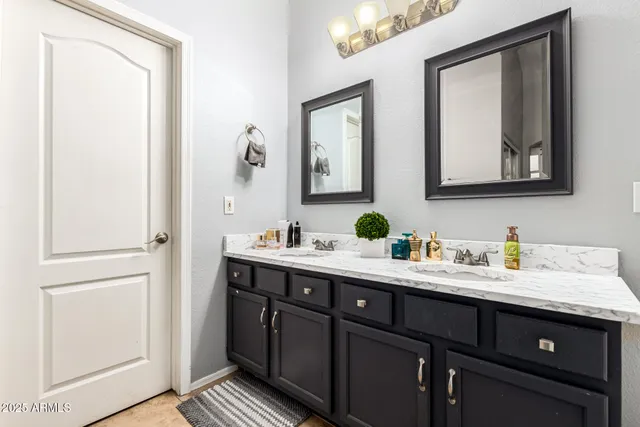 a view of bathroom with dual sinks