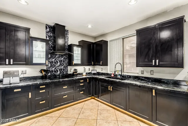 a kitchen with a sink and cabinets