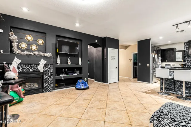 a kitchen with stainless steel appliances kitchen island granite countertop a refrigerator and a stove