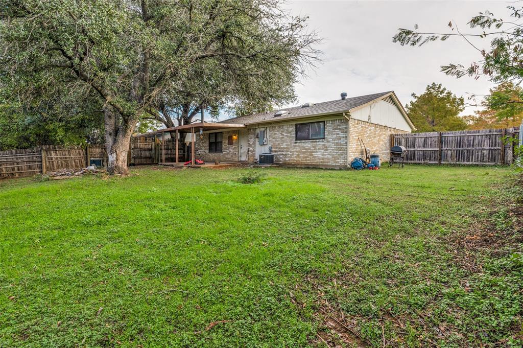 6102 Kelly Elliott Road Arlington, TX 76001 - Photo 12 of 12 a view of a yard in front of a house
