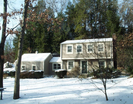 56 Woodcrest Road Boxford, MA 01921 - Photo 1 of 1 a front view of a house with a tree